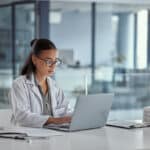 Female doctor on computer